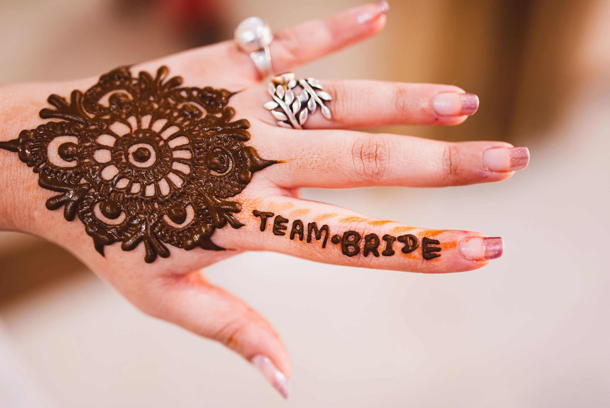 Henna detail representing client guidance and wedding preparation
